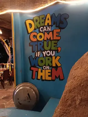 a sign that saysdreams can come true if you work on them at ABU Nubian Guest House in Aswan