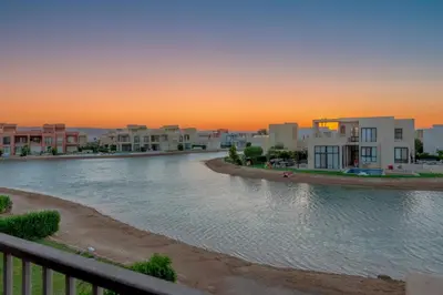 a view of a river with houses and buildings at NEW! 2BR Duplex in Tawila, Gouna Private Jacuzzi, Garden, Lagoon & Pool in Hurghada