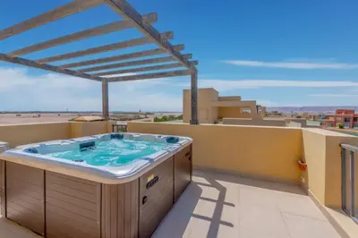 a hot tub on the roof of a house at NEW! 2BR Duplex in Tawila, Gouna Private Jacuzzi, Garden, Lagoon & Pool in Hurghada