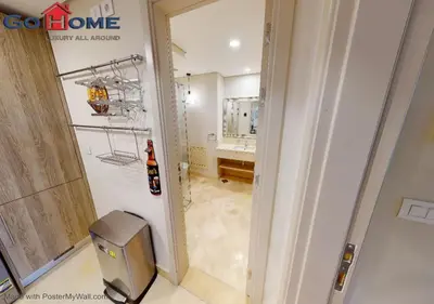 a room with a bathroom with a sink and a mirror at Stylish 1BR-Pool View M7-6B at Mangroovy El-Gouna in Hurghada