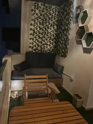 a living room with a couch and a bench at Benashti Hurghada apartment in Hurghada