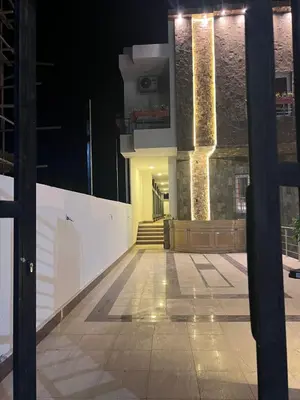 a view of a building at night at Magawish District in Hurghada