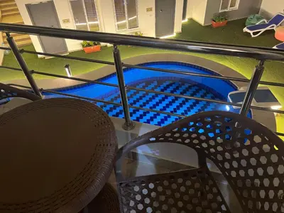 a view of a room with a table and chairs at Magawish District in Hurghada