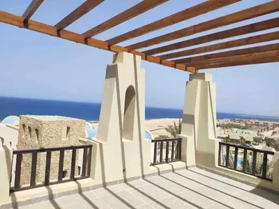 a balcony with a view of the ocean at Azzurra two-bedrooms apartment at Sahl Hasheesh in Hurghada