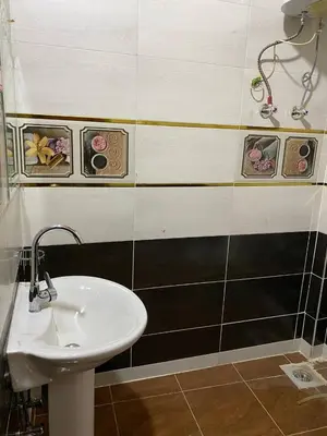 a bathroom with a sink and a sink SUP H H Chibahibahibahiba at Malika nubian house in Aswan