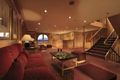 a living room with a couch and a table at Iberotel Amara Nile Cruise - Every Thursday from Luxor for 07 & 04 Nights - Every Monday From Aswan for 03 Nights in Luxor