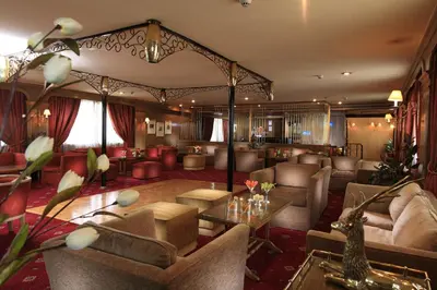 a living room with couches and a table at Iberotel Amara Nile Cruise - Every Thursday from Luxor for 07 & 04 Nights - Every Monday From Aswan for 03 Nights in Luxor