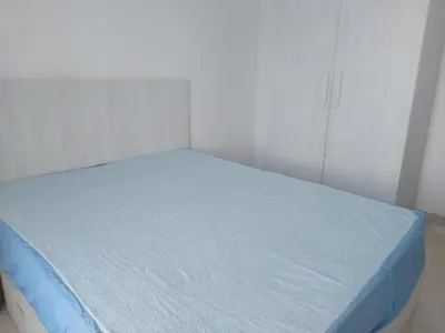 a bed with a blue mattress in a room at La bonita one bedroom apartment in Hurghada