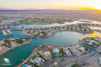 an aerial view of a marina at sunset at Fresh & Modern 1BR in El Gouna. Mangroovy Pool & Beach in Hurghada