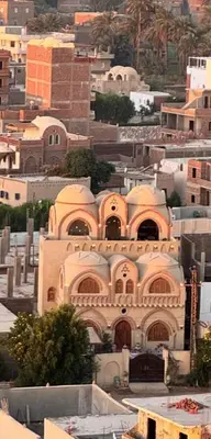 a large building on top of a city at Mystical habou domes villa private pool in Luxor