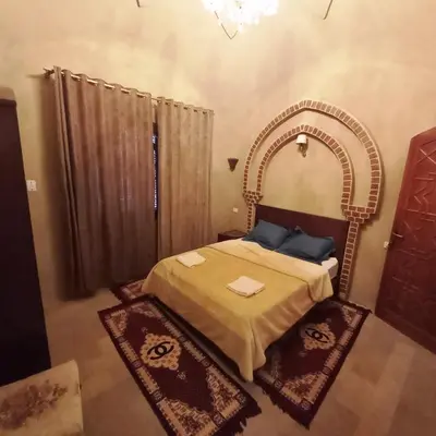 a bedroom with a large bed with a large mirror at Mystical habou domes villa private pool in Luxor
