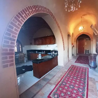 a large kitchen with an archway in a house at Mystical habou domes villa private pool in Luxor