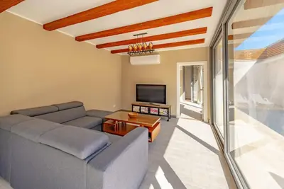 a living room with a couch and a tv at Modern & Comfy 2BR in Bali, El Gouna. Private Patio & Pool in Hurghada