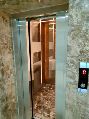 a elevator with a glass door in a room at Scandic resort 547 in Hurghada