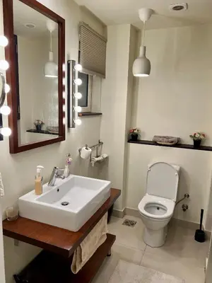 a bathroom with a white sink and a toilet at veranda sahl hasheesh in Hurghada
