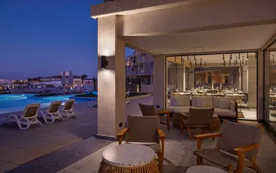 a balcony of a hotel with a table and chairs at Creek Hotel and Residences El Gouna in Hurghada