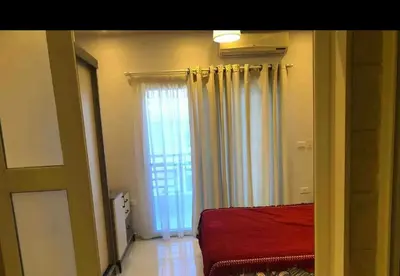 a bedroom with a bed and a large window at Sea view Apartment in Hurghada