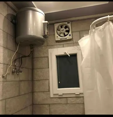 a bathroom with a window and a shower at Sea view Apartment in Hurghada