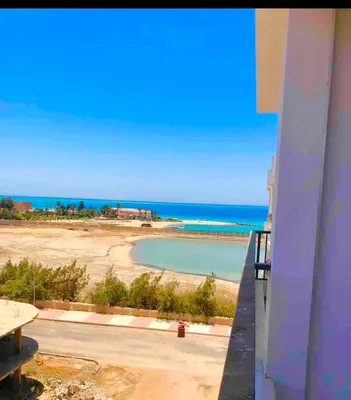 a view of the beach from the balcony of a condo at Sea view Apartment in Hurghada