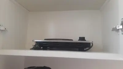 a black object is sitting on a white shelf at Hurghada-Magawish Studio 2 in Hurghada