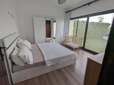 a bedroom with a bed and a large window at Somabay Retreat 2BR Apartment in Hurghada