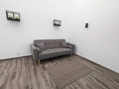 a living room with a couch and a rug at Somabay Retreat 2BR Apartment in Hurghada