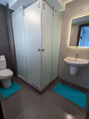 a bathroom with a toilet and a sink at Somabay Retreat 2BR Apartment in Hurghada