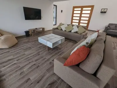 a living room with two couches and a coffee table at Somabay Retreat 2BR Apartment in Hurghada