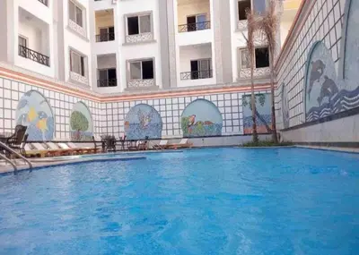 a swimming pool in the middle of a building at Entertainment Central Location in Hurghada