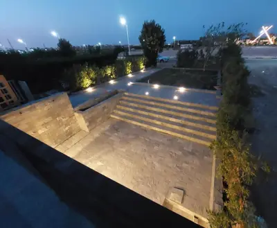 an empty amphitheater with stairs and lights at night at SOLA INN Hotel Hurghada in Hurghada