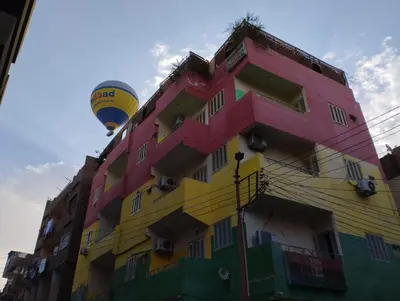 a colorful building and a hot air balloon at Bob Marley Peace hotel luxor in Luxor