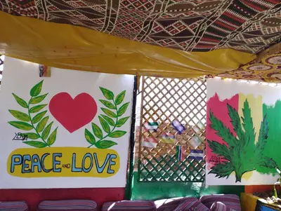 a tent with a peace love sign on it at Bob Marley Peace hotel luxor in Luxor