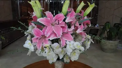 a bouquet of pink flowers in a vase on a table at Scandic Resort Hurghada in Hurghada