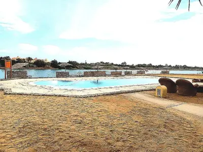 a swimming pool in the middle of a body of water at West golf 2bedroom in Hurghada
