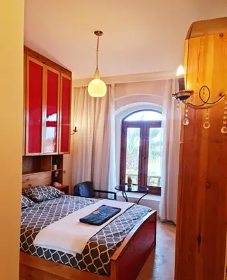 a bedroom with a large bed and a window at West golf 2bedroom in Hurghada