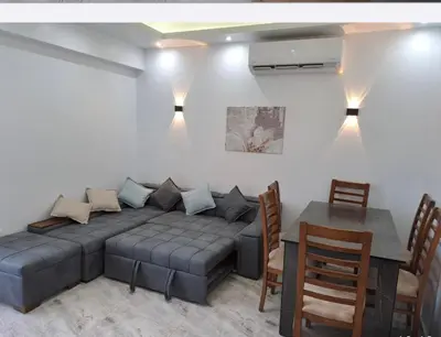 a living room with a couch and a table at SELENA BAY RESORT WITH PRIVATE BEACH,SEA VIEw in Hurghada