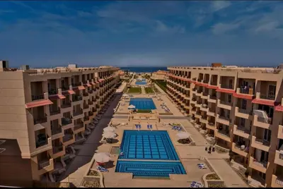 an aerial view of a swimming pool between two buildings at SELENA BAY RESORT WITH PRIVATE BEACH,SEA VIEw in Hurghada
