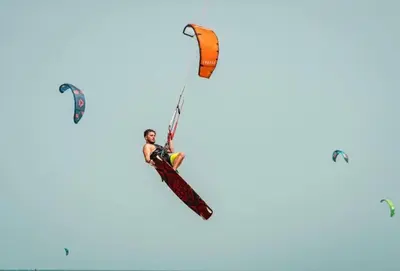 a man is kite surfing in the sky at SELENA BAY RESORT WITH PRIVATE BEACH,SEA VIEw in Hurghada