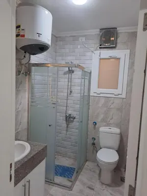a bathroom with a shower and a toilet and a sink at selena bay resort hurgada in Hurghada