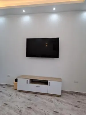 a flat screen tv sitting on top of a white wall at selena bay resort hurgada in Hurghada