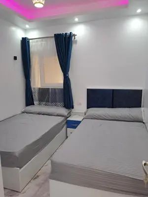 a bedroom with two beds and a window at selena bay resort hurgada in Hurghada