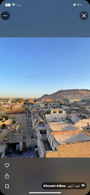 a screenshot of the visitor advisor app with a view of a city at Nuba Heart in Aswan