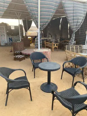 a group of chairs and tables in a tent at Nuba Heart in Aswan