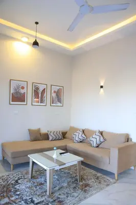 a living room with a couch and a coffee table at Royal Nile Villas - Nile View Apartment 2 in Luxor