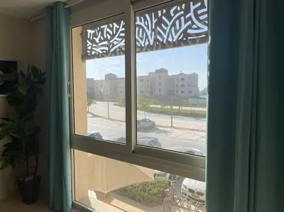 a window with a view of a parking lot at Mangroovy- Sensational 1BR Sea & Kite view in Hurghada