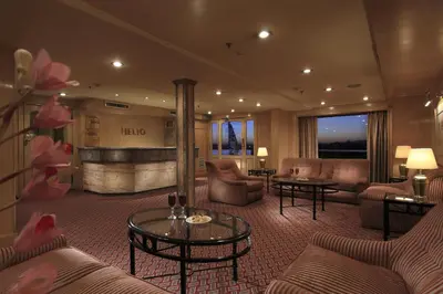 a hotel lobby with couches and tables at Iberotel Helio Nile Cruise - Every Monday from Luxor for 07 & 04 Nights - Every Friday From Aswan for 03 Nights in Luxor