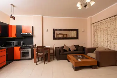 a living room with a couch and a table at one bedroom apartment in Hurghada