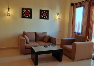 a living room with a couch and a coffee table at Baron palace 41 in Hurghada