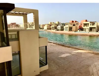 a view of a beach with houses and the water at Emos Villa in Hurghada