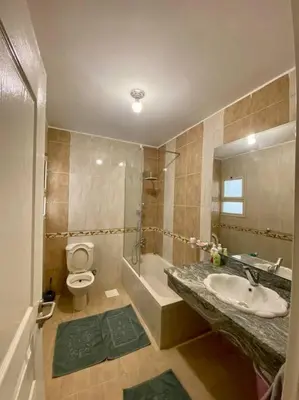 a bathroom with a sink and a toilet at Apartment in el karma aqua beach resort hurghada near El gouna in Hurghada